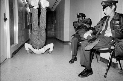 Sophie Bramly, "Muhammad dancing in front of two cops at Bronx River Center"
